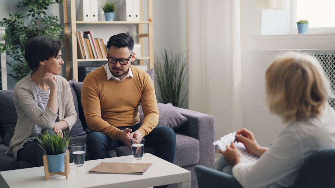 a group of people sitting around a living room